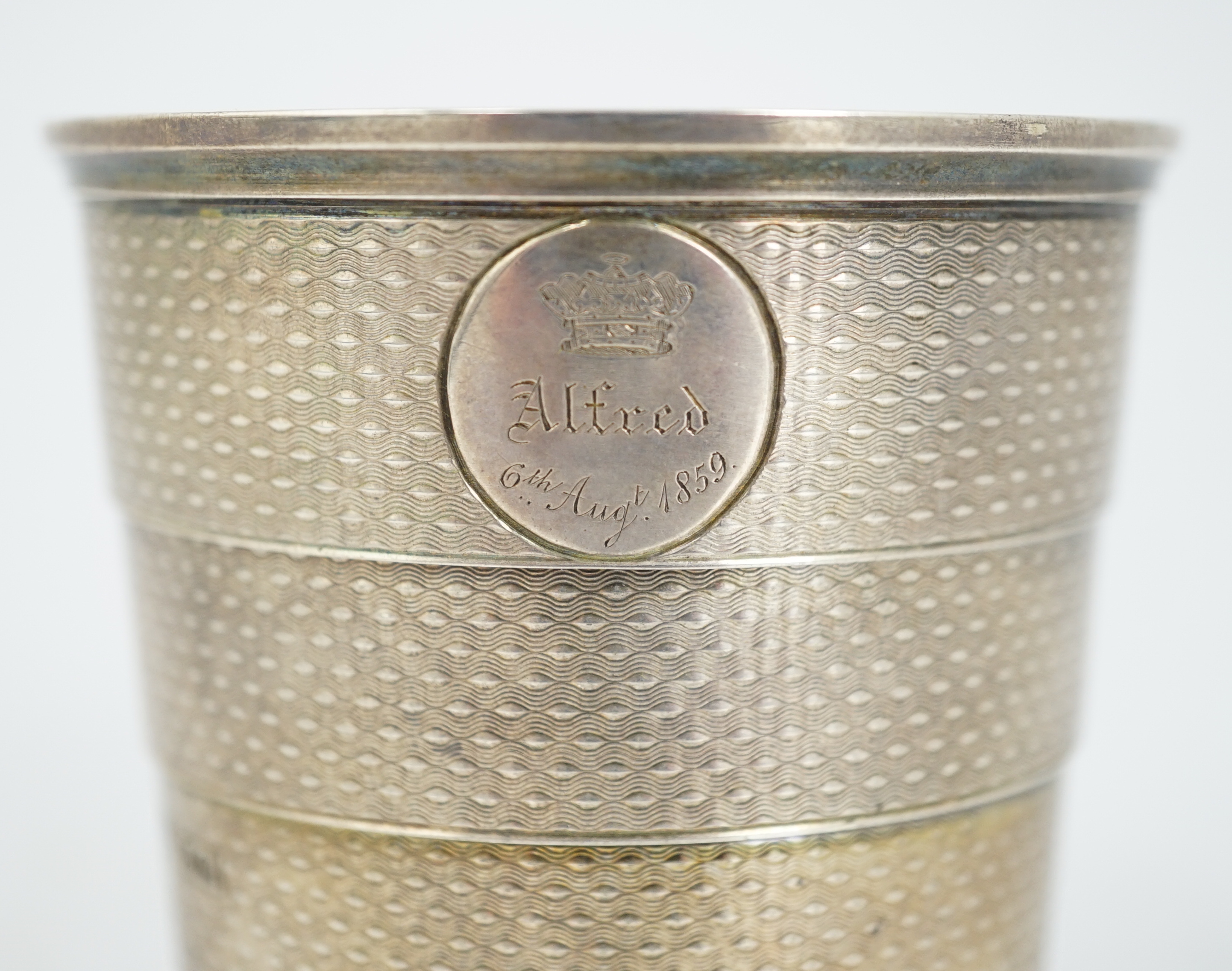 ROYAL INTEREST: A cased Victorian textured silver collapsible travelling cup, by Brownett & Rose, with later engraved inscription, 'Presented By Her Royal & Imperial Highness The Duchess of Saxe Coburg & Gotha Duchess of